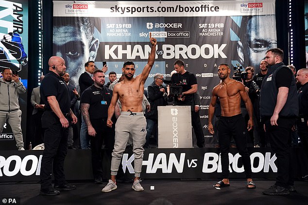 Amir Khan (centre) also weighed in within the catchweight limit, clocking in at 10st 7lbs 5oz