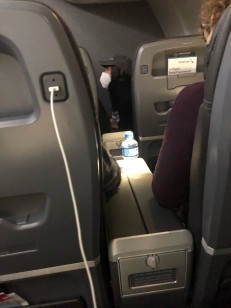 A covert snap of AOC in her first-class seat.