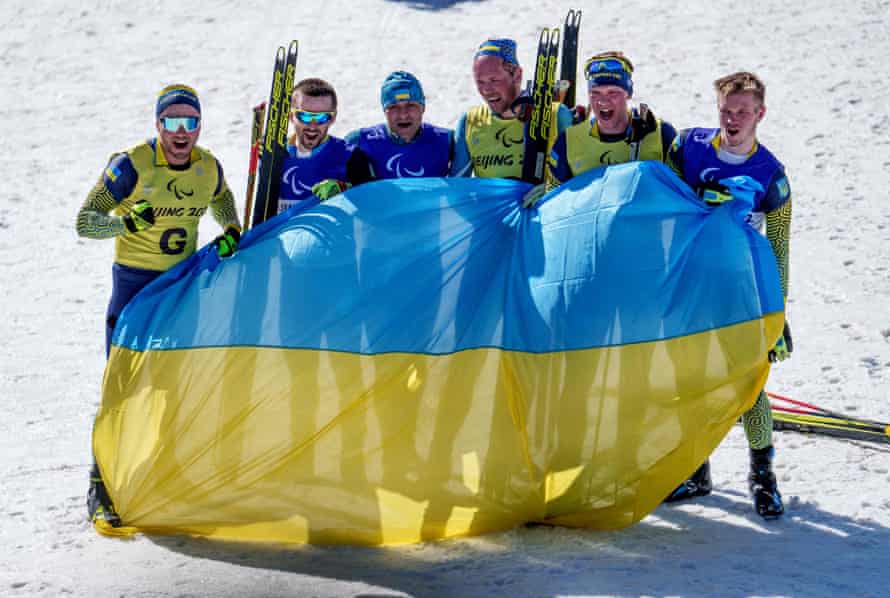 Ukraine's gold medalist Vitaliy Lukyanenko (third left) with the other team members who completed a podium sweep in the men's middle distance vision impaired for biathlon