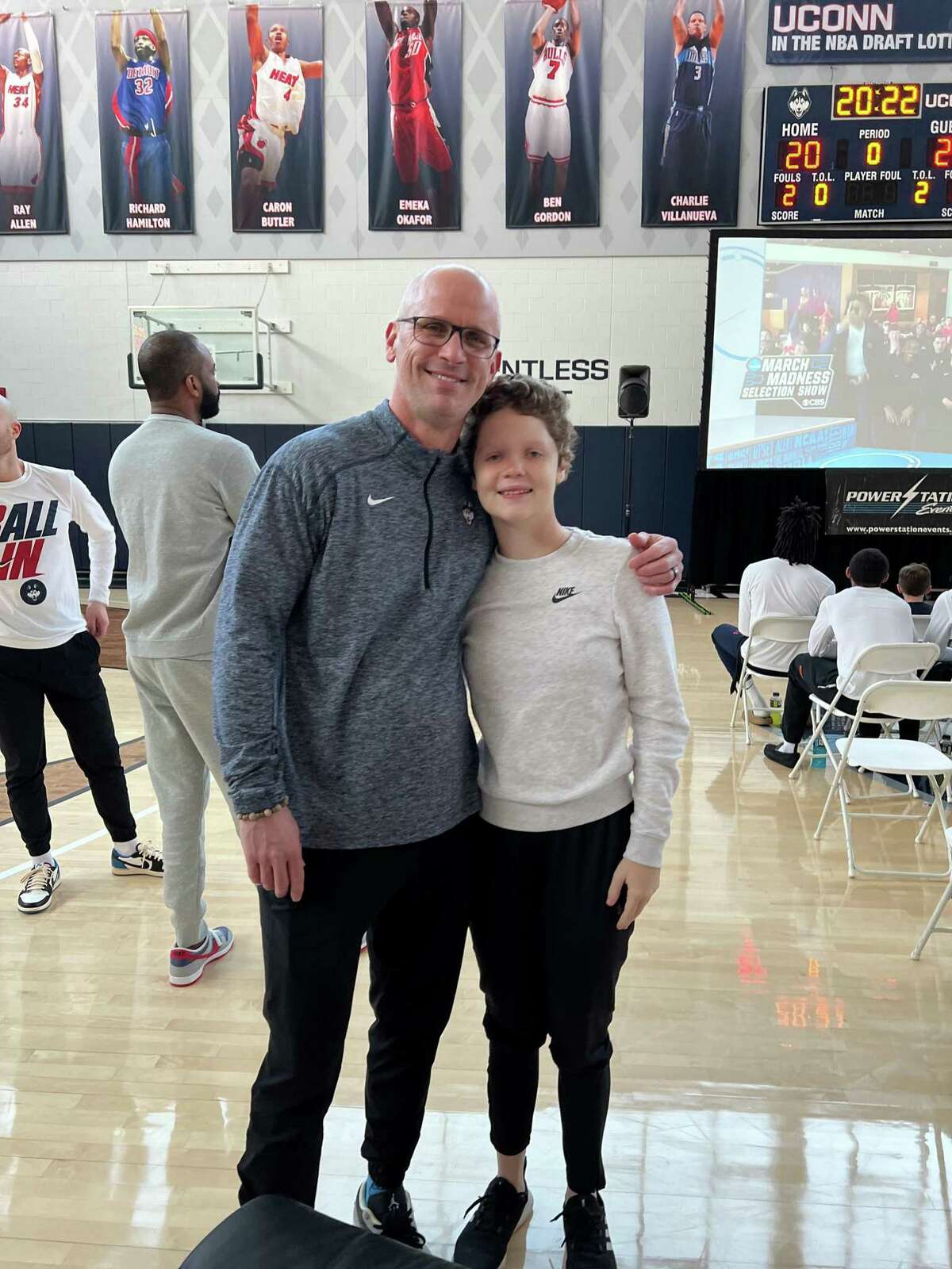 Aubrien Jimenez, 15, is battling a rare form of cancer. She was a guest of UConn for a Big East Tournament semifinal Friday in New York and for a Selection Sunday gathering Sunday at the Werth Champions center. She is pictured here with coach Dan Hurley.