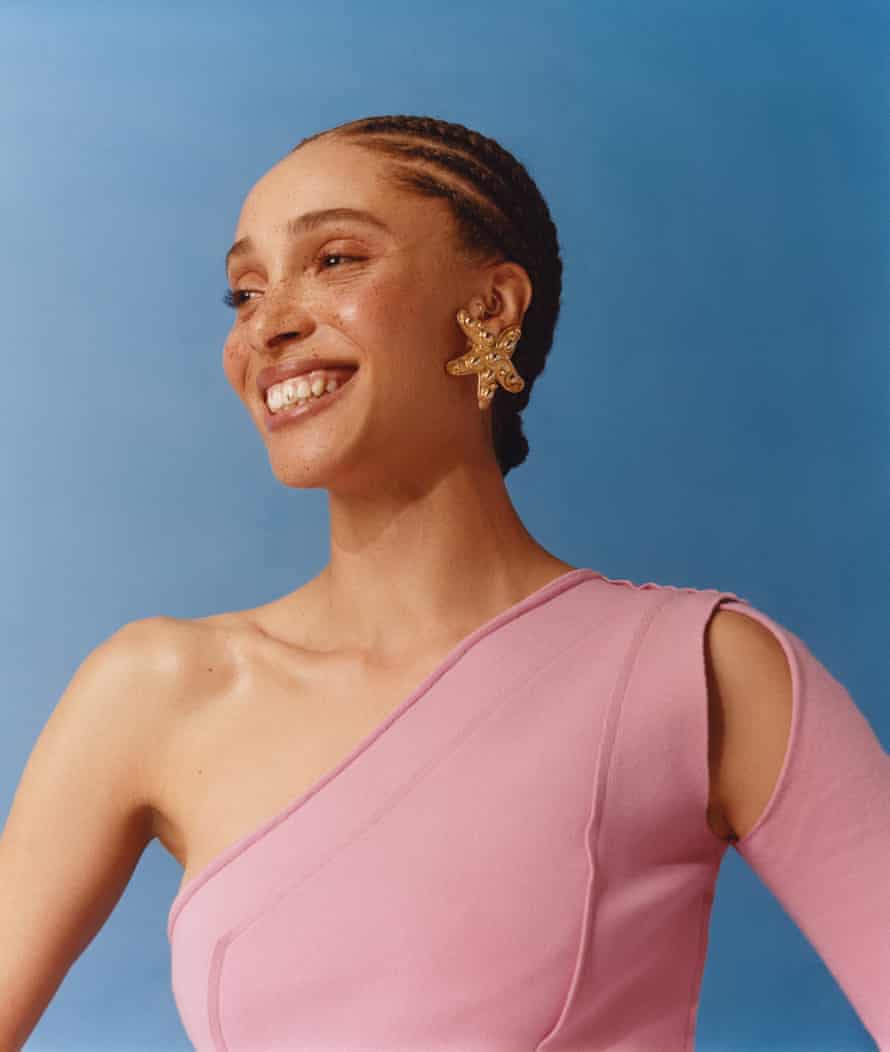 Adwoa Aboah wears pink, one-shoulder dress by Allbright and a starfish earring by Aralda.