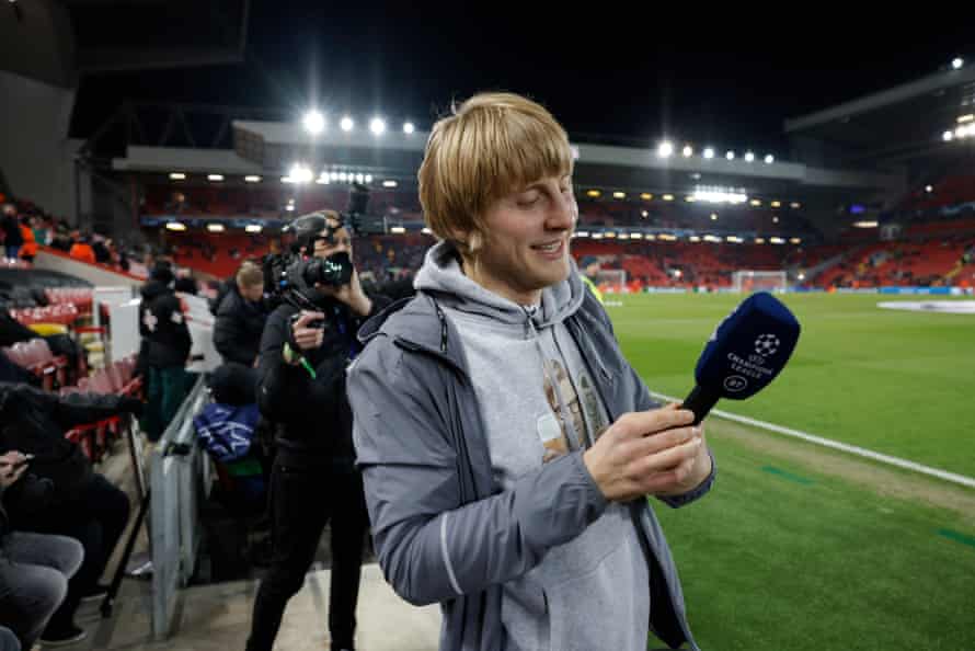 Paddy Pimblett admires the microphone before giving a live TV interview for BT Sport.