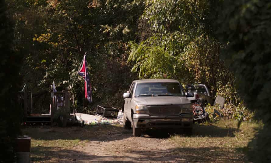 A Confederate flag hangs from a porch on a property in Munith, Michigan, in October 2020, where law enforcement officials said suspects accused in a plot to kidnap Gretchen Whitmer met to train and make plans.