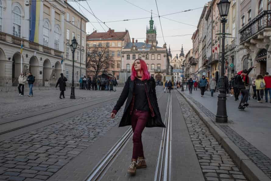 Judis, a transgender woman, walks down a street in Ukraine