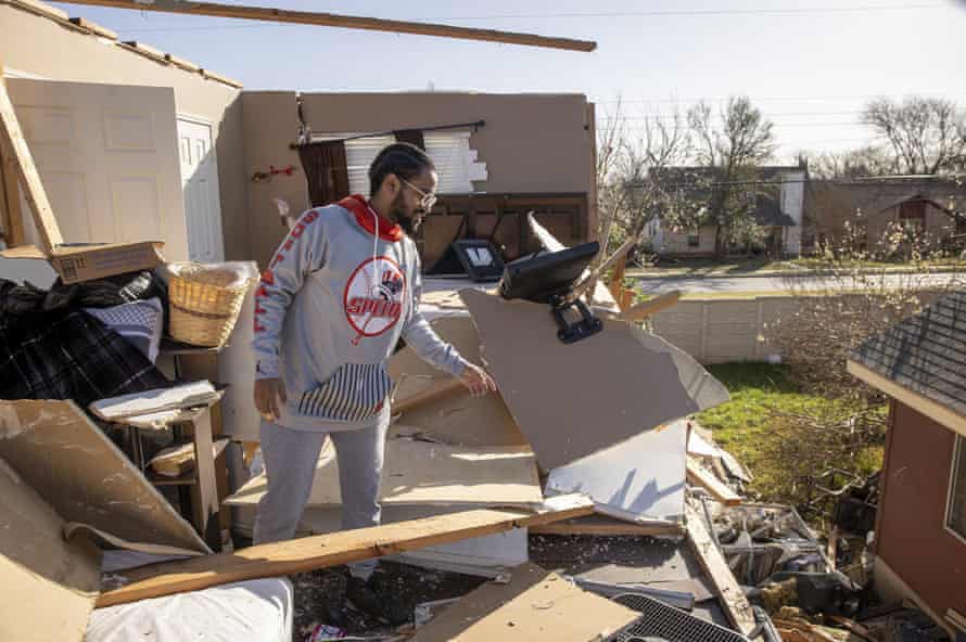 J-Bo Moore looks at the tornado damage to his house in Round Rock, Texas.
