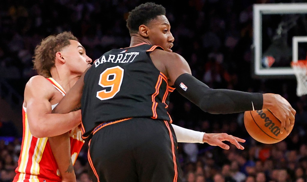 RJ Barrett, who scored 30 points, makes a move on Trae Young during the Knicks' loss.