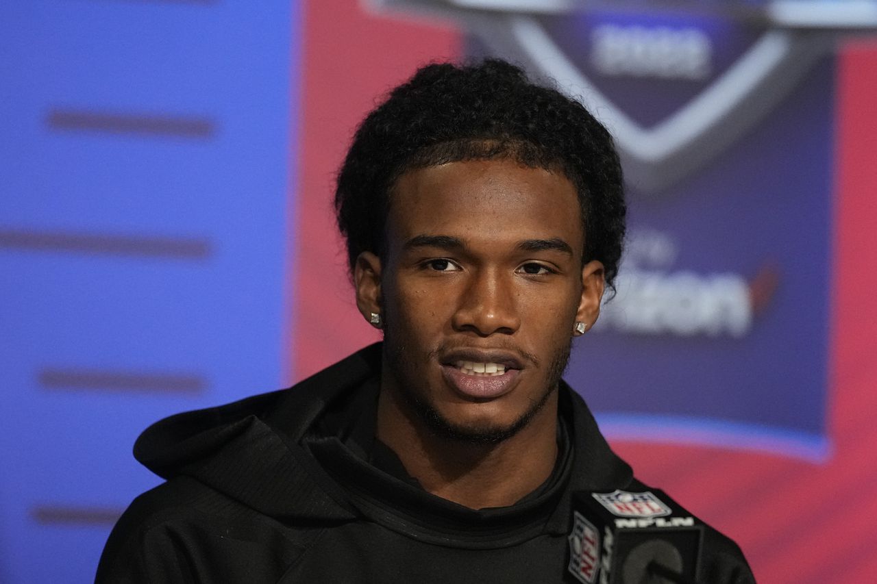 Ohio State wide receiver Garrett Wilson speaks during a press conference at the NFL football scouting combine, Wednesday, March 2, 2022, in Indianapolis.