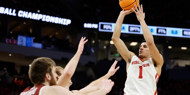 Wisconsin's Johnny Davis shoots during the first half of a first round NCAA college basketball tournament game against Colgate Friday, March 18, 2022, in Milwaukee. 