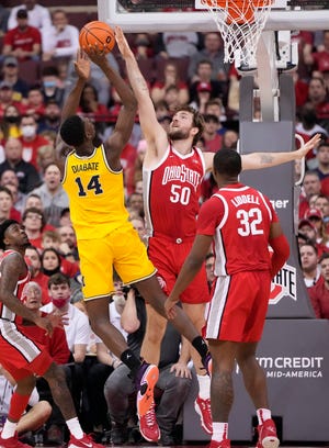 Ohio State Buckeyes center Joey Brunk (50) defends Michigan Wolverines forward Moussa Diabate (14) during the first half of the NCAA men's basketball game at Value City Arena in Columbus on March 6, 2022. 