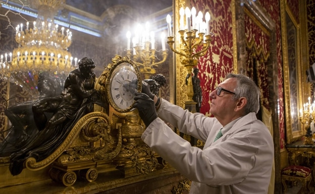 Manuel Santolaya adjusts the mechanism of one of the clocks in the Royal Palace. 