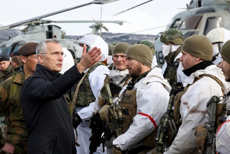 NATO Secretary General Jens Stoltenberg speaks with Dutch marines at a base in Bardufoss in the Artic Circle, Norway on Friday.