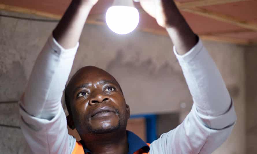 A solar home system is installed in a refugee's house in Kigeme camp.