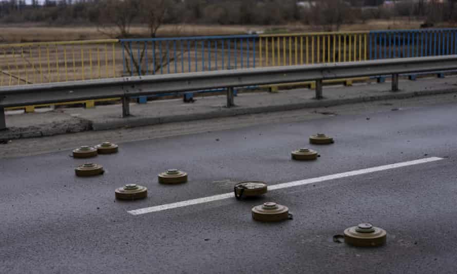 Anti tank mines are displayed on a bridge in Bucha, in the outskirts of Kyiv, Ukraine, Saturday, April 2, 2022.