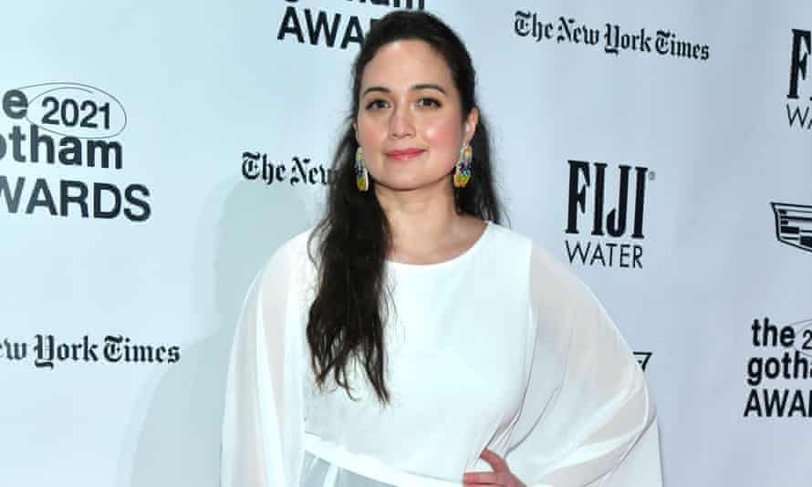 Lily Gladstone poses in a white dress at the Gotham Awards.