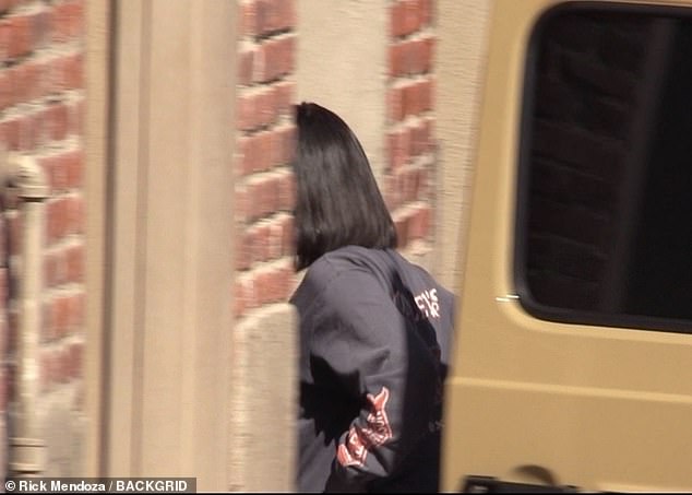 Zooming in: By the time she arrived, the booing from the crowd had intensified, and Kourtney appeared to rush into the building even faster than her sisters and mother