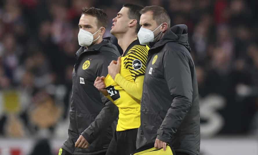 Giovanni Reyna (centre) left Dortmund's game at Stuttgart in tears.