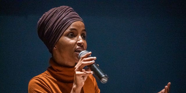 U.S. Rep. Ilhan Omar speaks at a town hall in South Minneapolis on ICE and the administration's immigration detention policies, at the Colin Powell Center in Minneapolis on Tuesday, Aug. 27, 2019. (Richard Tsong-Taatarii/Star Tribune via AP)
