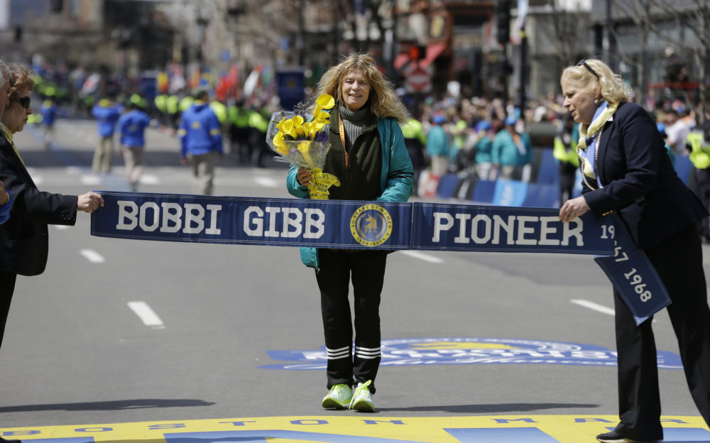 Bobbi Gibb, first woman to run the Boston Marathon in 1966, crosses at the finish line of the 120th Boston Marathon on April 18, 2016, in Boston. (Elise Amendola/AP)