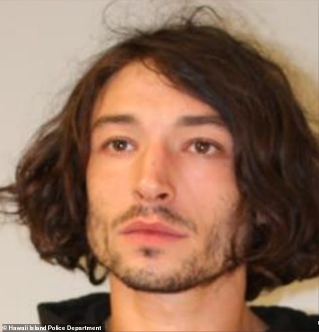 The Flash star Ezra Miller was arrested for a second time in Hawaii, just weeks after they 'threw a chair at a woman's head when she asked him to leave her home’ n the Leilani State Subdivision in Pāhoa shortly after 1 a.m. on Tuesday