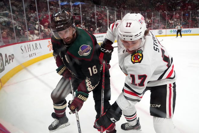 Apr 20, 2022; Glendale, Arizona, USA; Arizona Coyotes left wing Andrew Ladd (16) and Chicago Blackhawks center Dylan Strome (17) battle for the puck during the second period at Gila River Arena. Mandatory Credit: Joe Camporeale-USA TODAY Sports