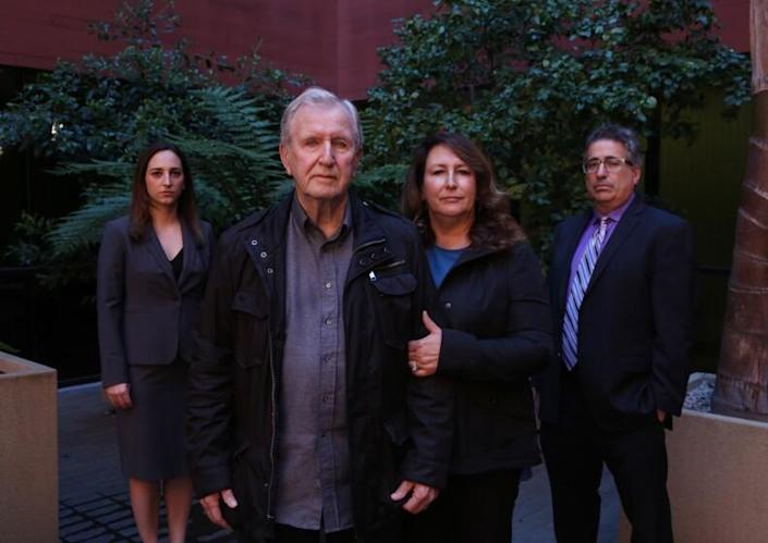 MARINA DEL REY, CA-February 13, 2018: Francis Kerrigan and Carole Meikle, center, are photographed with lawyers Ryan E. Hall, far left, and V. James DeSimone, far right. Kerrigan and Carole contend the Orange County coroner switched one dead homeless man's body for another to cover up a botched death notification last May. The Orange County Sheriff-Coroner has yet to explain how her office misidentified a body found behind a phone store as Frankie M. Kerrigan - a homeless man who later turned up alive on the patio of one of his pallbearers. The coroner later admitted the blunder and said the body that the Kerrigan family buried belonged to John Dickens, 54, another homeless man. Dickens' body was exhumed, and his cremated ashes were sent to his family in Kansas. (Katie Falkenberg / Los Angeles Times)