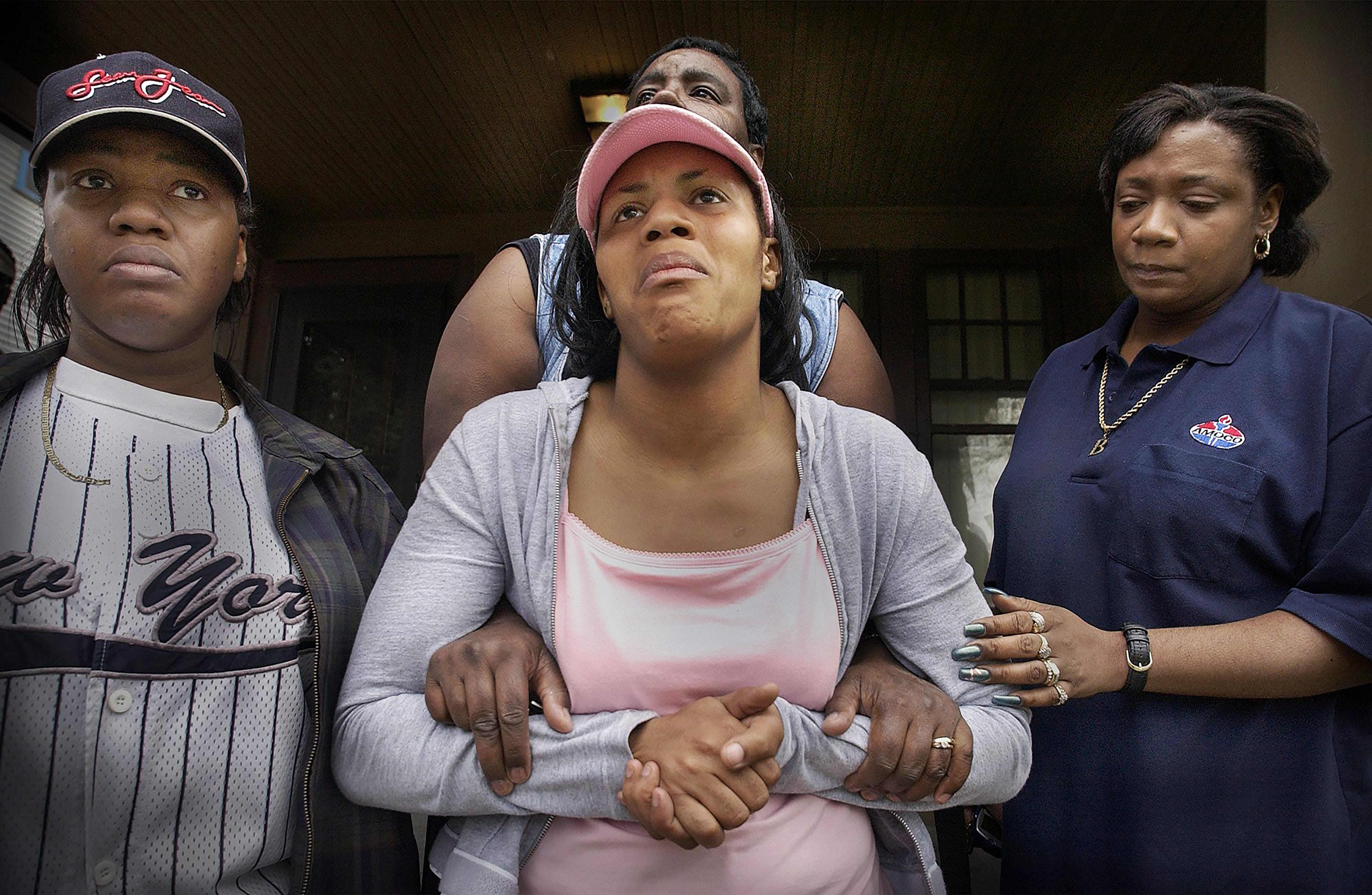 Ayanna Patterson pleads for the safe return of her daughter in 2002. With Patterson are her cousin, Jamice Rollins, left, and aunts Emma Viverette, behind her, and Theresa Shumpert, right.