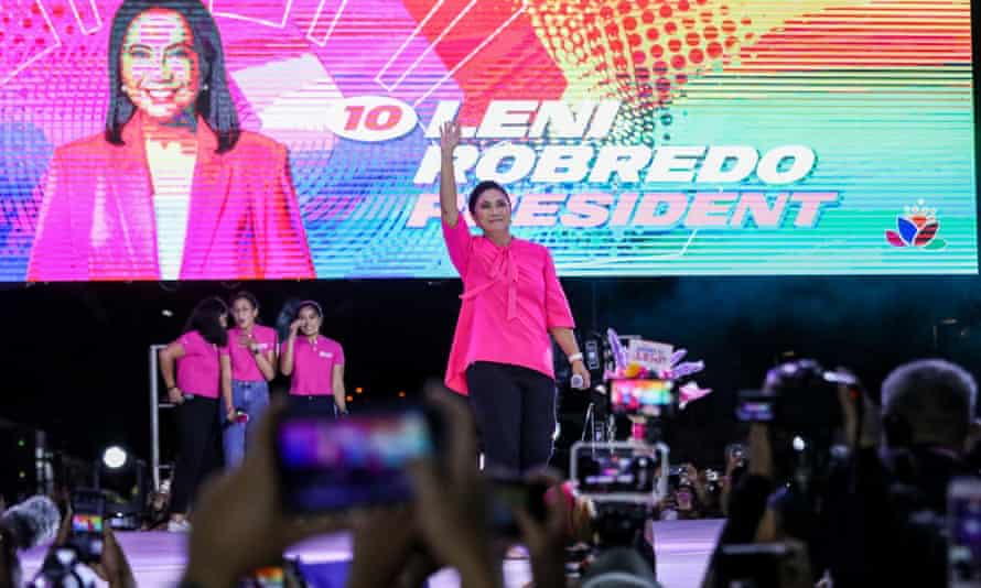 Vic-president and presidential hopeful Leni Robredo gestures as she arrives for her final campaign rally in Makati City, Metro Manila, on 7 May.