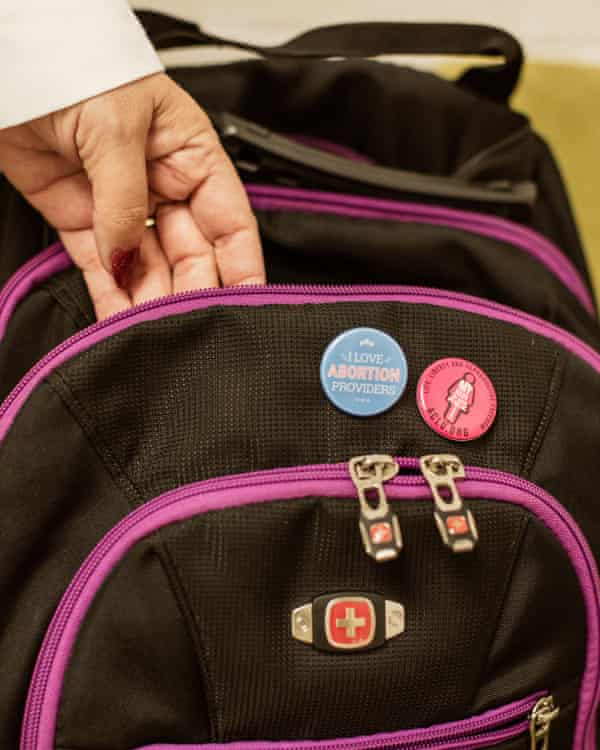 backpack with pins on it.  One says 'i love abortion providers', another says ACLU