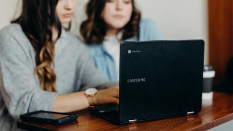 Two women using a Samsung Chromebook laptop