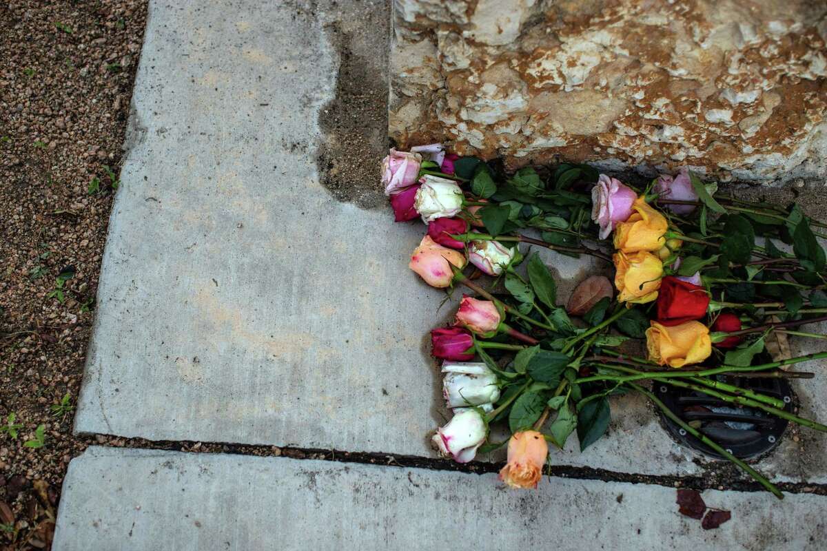Flowers are left at the base of a monument outside the SSGT Willie de Leon Civic Center in Uvalde, Texas, on Wednesday morning, May 25, 2022. Harrowing details began to emerge Wednesday of the massacre inside a Texas elementary school, as anguished families learned whether their children were among those killed by an 18-year-old gunman?•s rampage in the city of Uvalde hours earlier. (Kaylee Greenlee/The New York Times)