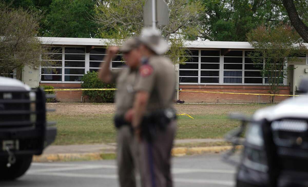 State troopers stand outside of Robb Elementary School in Uvalde, Texas, on May 24, 2022. - An 18-year-old gunman killed 14 children and a teacher at an elementary school in Texas on Tuesday, according to the state's governor, in the nation's deadliest school shooting in years. (Photo by allison dinner / AFP) (Photo by ALLISON DINNER/AFP via Getty Images)