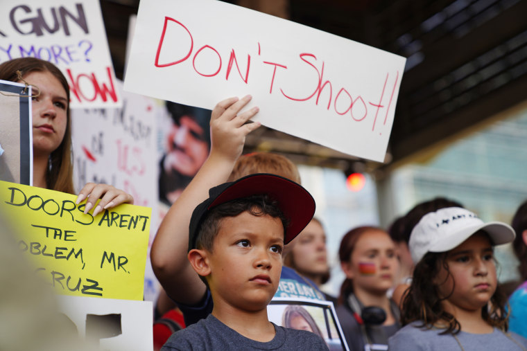 Young protesters outside the annual NRA meeting in Houston. 