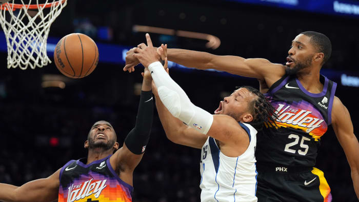 Phoenix Suns guard Chris Paul (3) and Dallas Mavericks guard Jalen Brunson (13) and Phoenix Suns forward Mikal Bridges (25) go after a loose ball during the second half of game one of the second round for the 2022 NBA playoffs against the Dallas Mavericks.