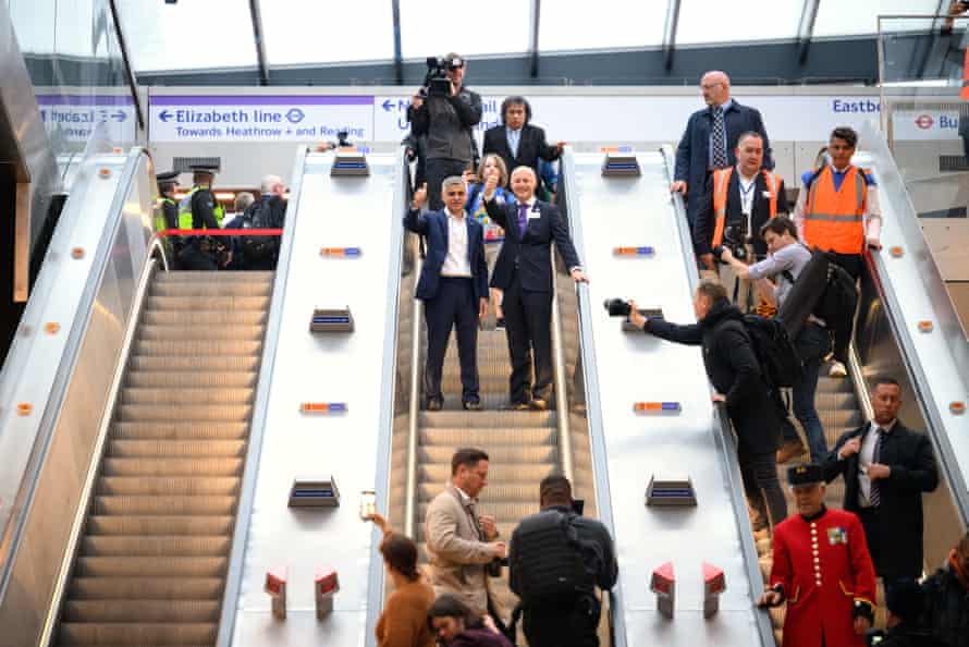 Sadiq Khan (left) and the Transport for London commissioner, Andy Byford, on an escalator as they prepared to travel on the first eastbound train on the Elizabeth line this morning.