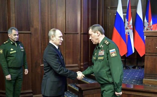 Russian President Vladimir Putin shakes hands with Chief of the General Staff Valeri Germasimov