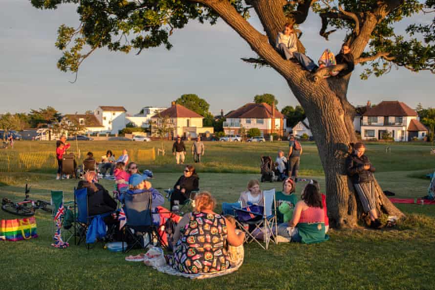A number of families come together at evening at Penarth Cliff Tops for the lighting of the fire beacons that will start the celebrations for the Queen's Platinum Jubilee.