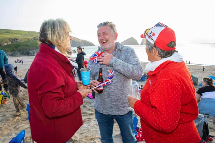 Sally Main, Jim Main and Averil Billing at a beach party at Holywell Bay in Cornwall, organized by the local Surf Lifesaving Club.
