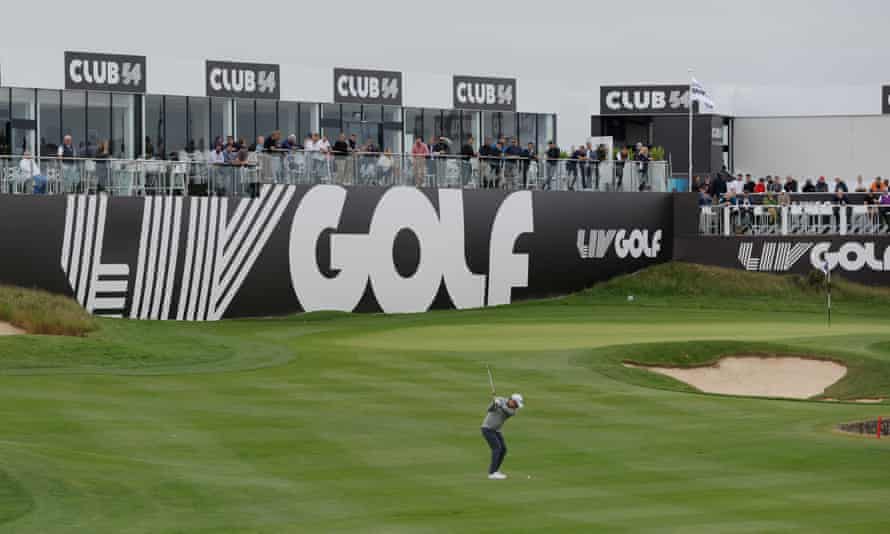 Oliver Bekker plays onto the 18th green as fans watch on from adjacent terraces.