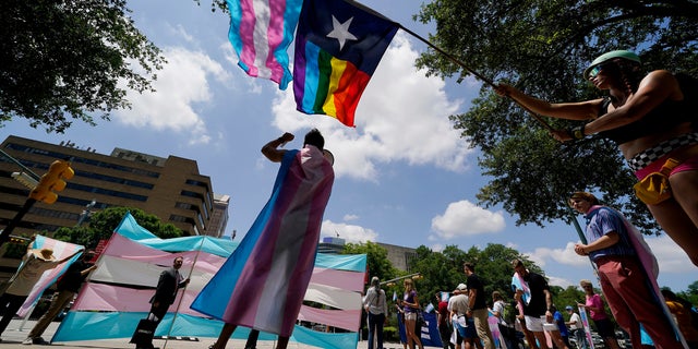 Demonstrators gather on the steps to the State Capitol to speak against transgender-related legislation bills being considered in the Texas Senate and Texas House, May 20, 2021, in Austin, Texas. 