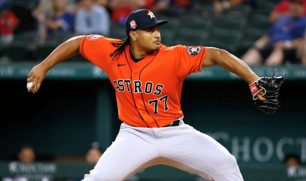 ARLINGTON, TX - JUNE 15: Luis Garcia #77 of the Houston Astros pitches against the Texas Rangers during the first inning at Globe Life Field on June 15, 2022 in Arlington, Texas.