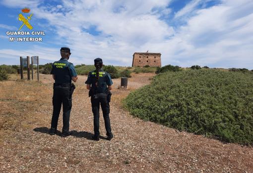 Two agents of the Civil Guard on surveillance tasks on the island