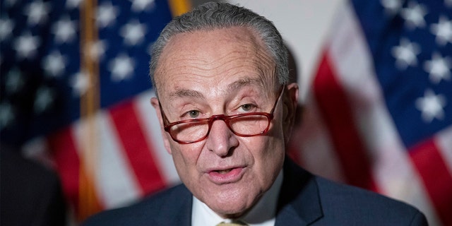 Senate Majority Leader Chuck Schumer, D-N.Y., responds to questions from reporters during a press conference on Tuesday, Jan. 18, 2022.
