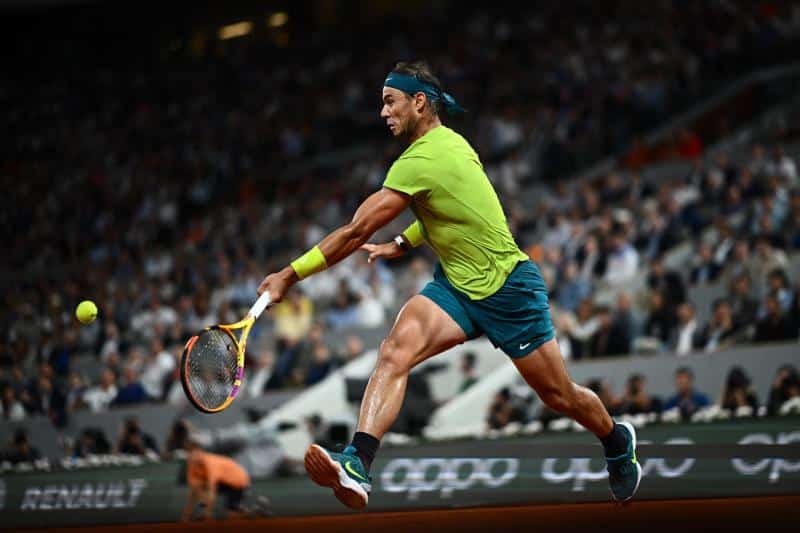 Rafa Nadal hits a ball in a match at the present Roland Garros.